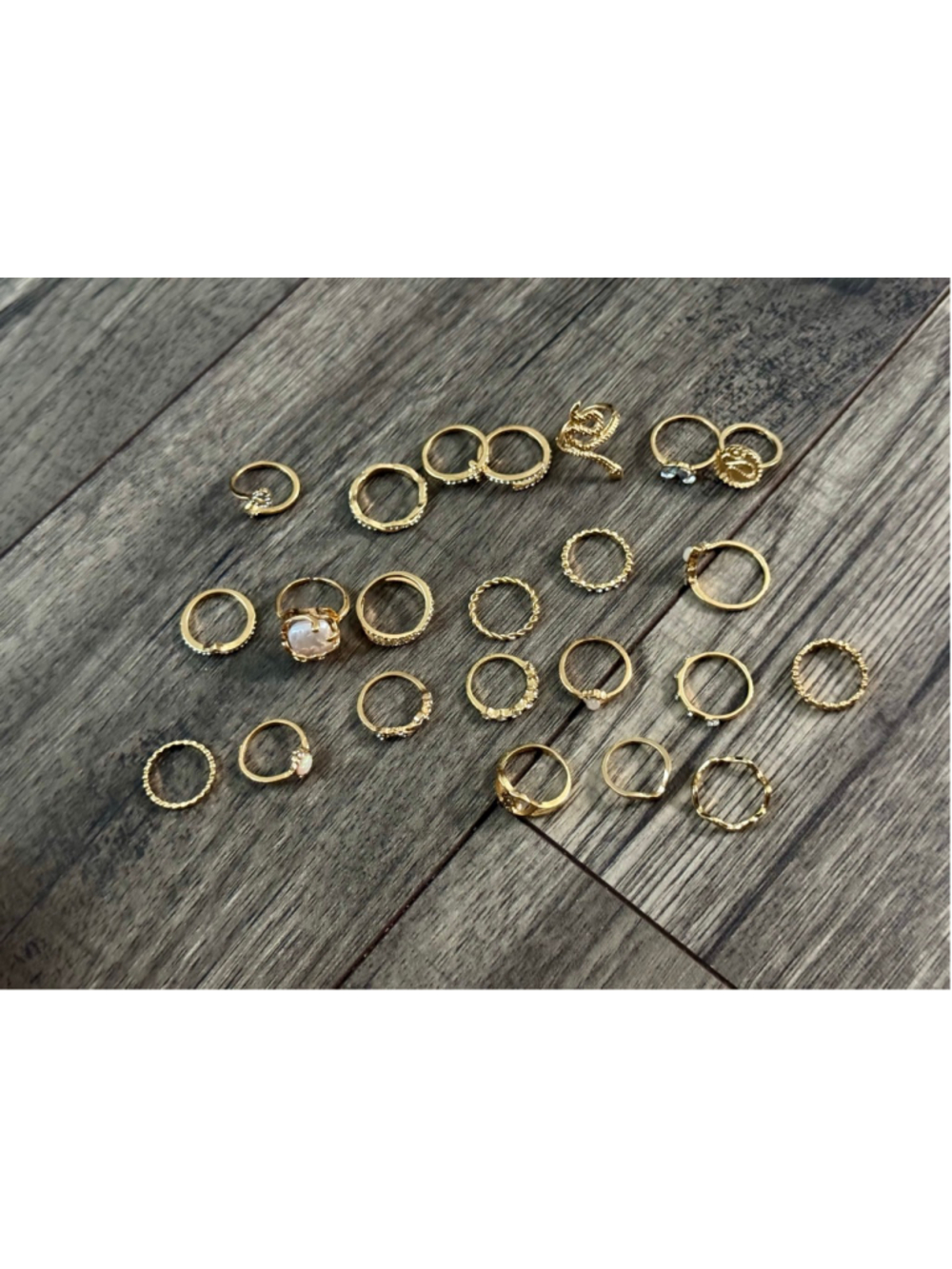 23 Gold Plated Rings - all different sizes but ranging 6-9 I believe!